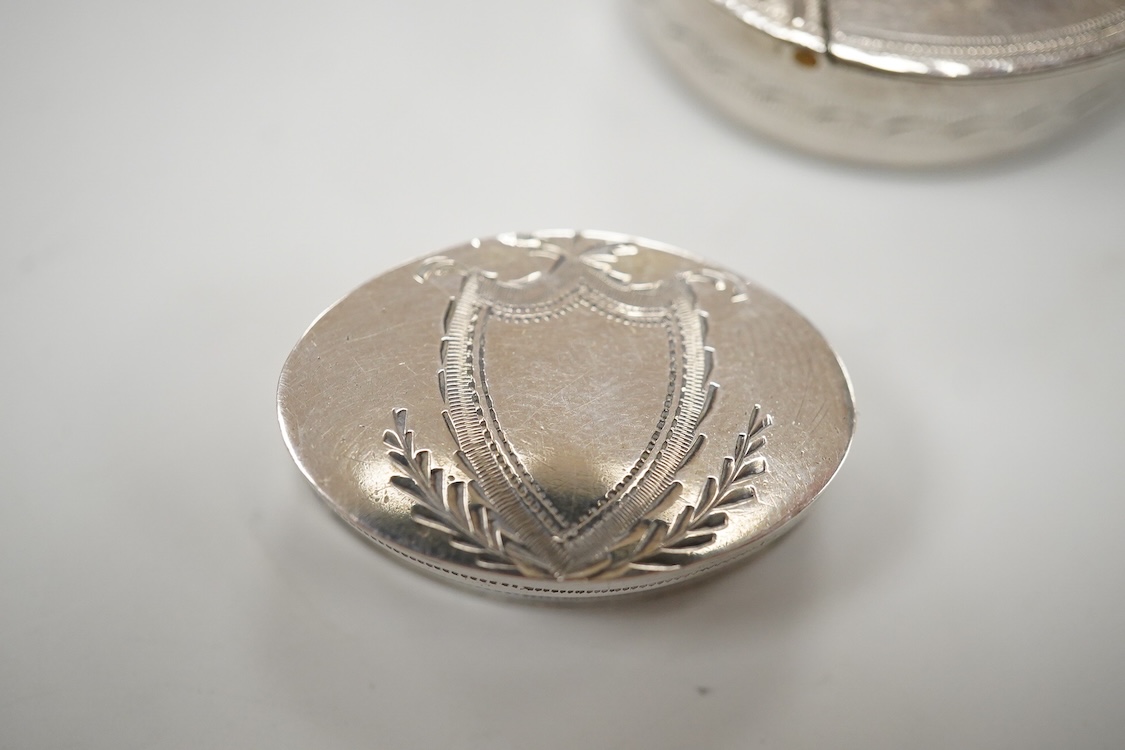 Two George III engraved silver oval patch boxes, largest with hinged cover, Samuel Pemberton, Birmingham, 1818, 28mm, the smaller by John Thornton, Birmingham, 1800.